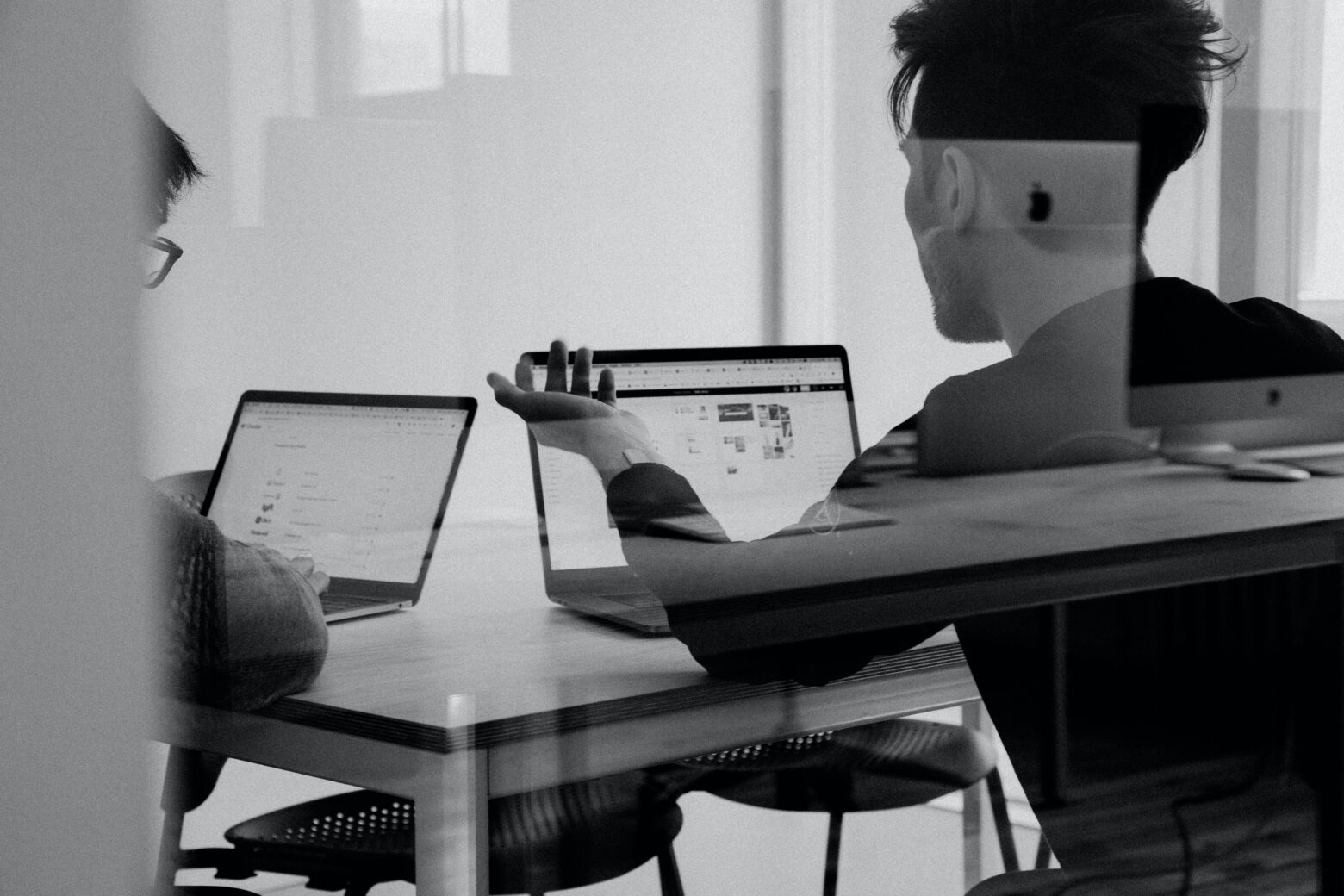 Python developers working with a computer