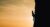 man climbing vertically a mountain