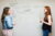 women discussing with flipboard